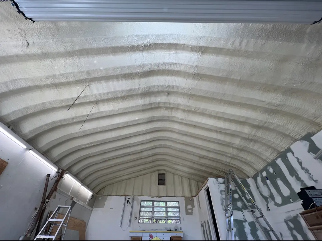 Spray polyurethane foam applied to the underside of a metal roof deck in Little River